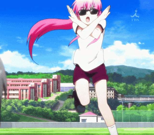a girl with pink hair and sunglasses is jumping in the air with the tbs logo behind her