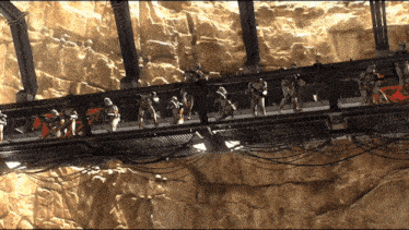 a group of stormtroopers standing on a bridge
