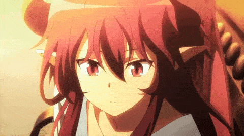 a close up of a girl with long red hair