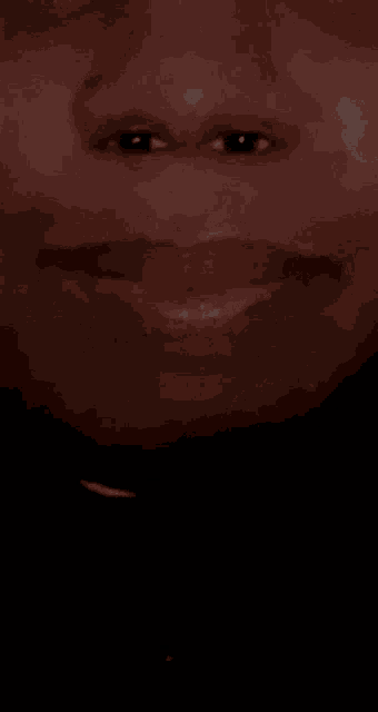 a close up of a person 's mouth with their tongue sticking out .