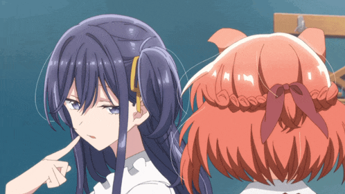 a girl with blue hair is standing next to a girl with orange hair