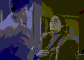 a black and white photo of a man and woman