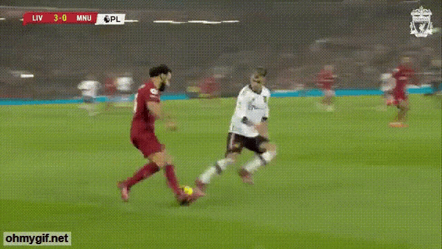 a soccer player with the number 6 on his jersey kicks a ball