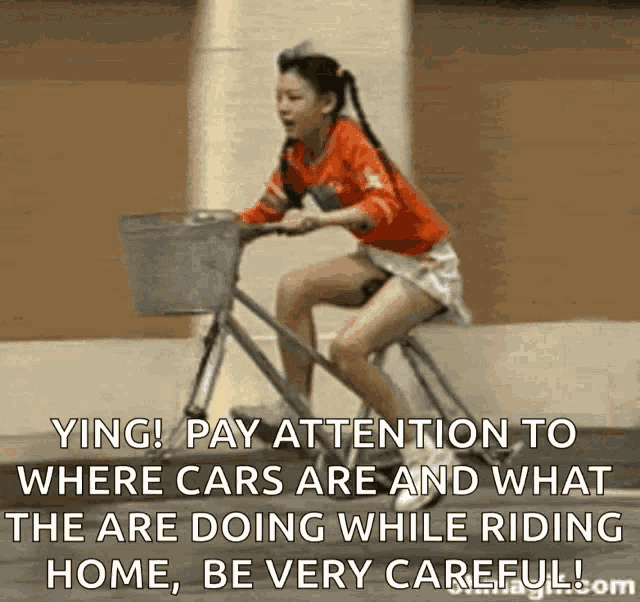 a woman is riding a bike with a basket and a caption that says ying