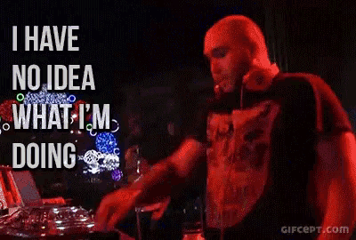 a man playing a dj set with the words " i have no idea what i 'm doing " behind him