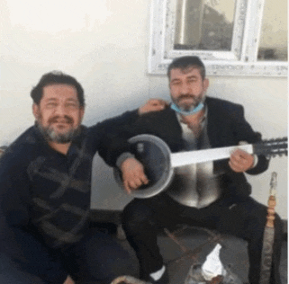 two men are posing for a picture one is playing a banjo and the other is playing a guitar