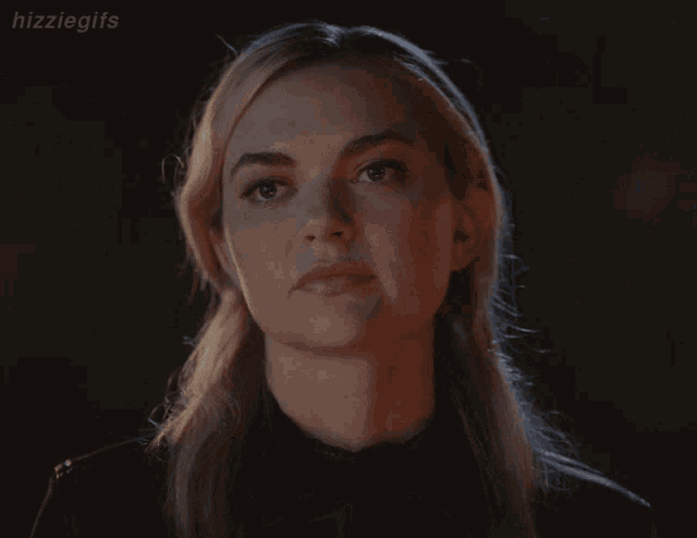 a close up of a woman 's face with the hashtag hizziegifs