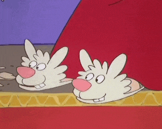 a pair of slippers that look like a rabbit 's face