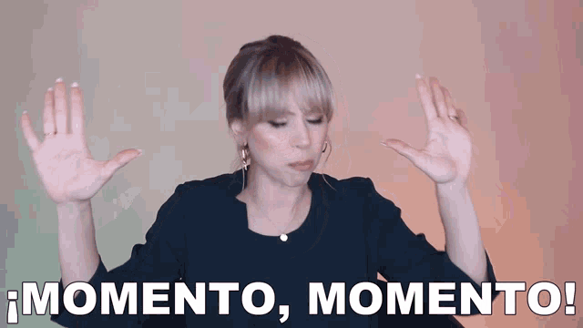 a woman with her hands in the air and the words momento momento written below her