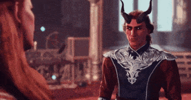 a man with horns on his head is talking to another man in a video game .