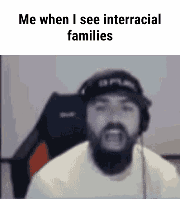 a man with a beard wearing headphones and a hat says me when i see interracial families