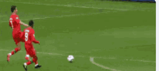 a soccer game is being played in front of an ad for hyundai .