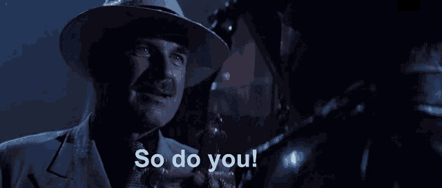 a man in a hat says so do you in a dark room
