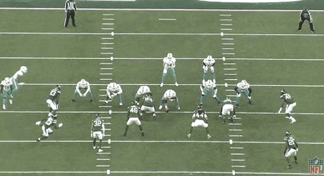 a football game is underway and the nfl logo can be seen