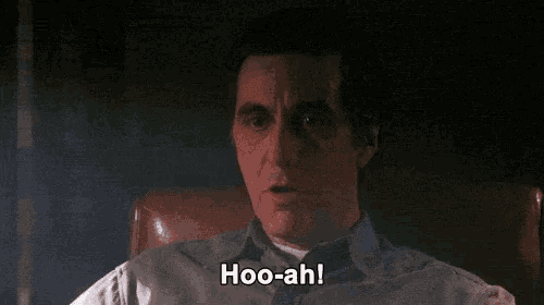 a man is sitting in a chair with his eyes closed and says `` hoo-ah '' .