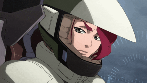 a woman with red hair is wearing a helmet and looking at the camera