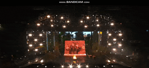 a group of people standing on a stage with the words www.bandicam.com at the top