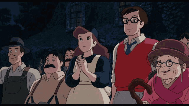 a group of people are standing in a line with one woman wearing glasses