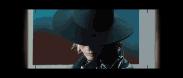 a woman in a hat is swimming in a blue pool
