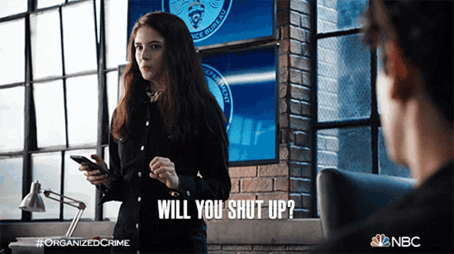 a woman talking to a man with the words will you shut up below her