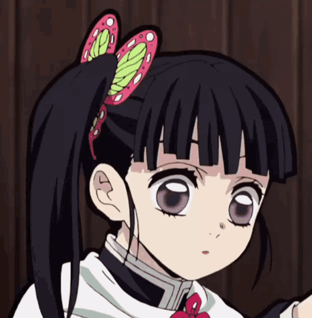 a close up of a girl with a ponytail