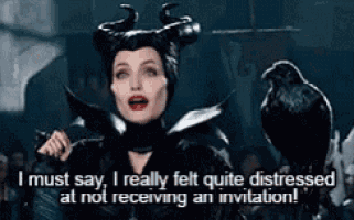 a woman with horns is standing next to a black bird and says i must say i really felt quite distressed