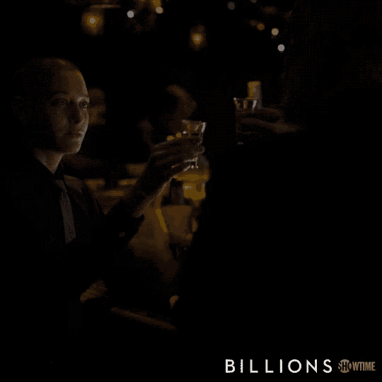 a showtime ad for billions shows a man drinking a shot