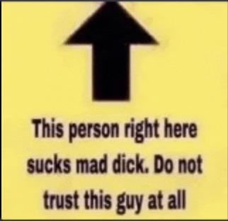 a sign that says this person right here sucks mad dick