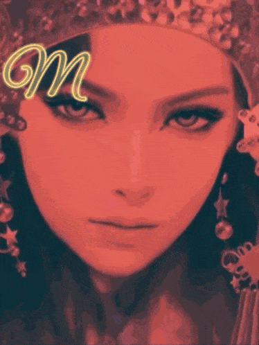 a close up of a woman 's face with the letter m above her head