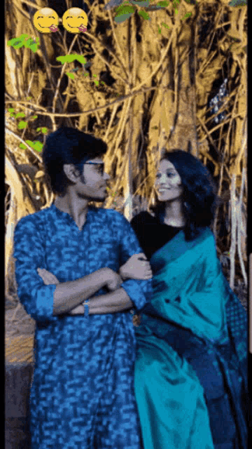 a man and a woman standing next to each other with smiley faces behind them