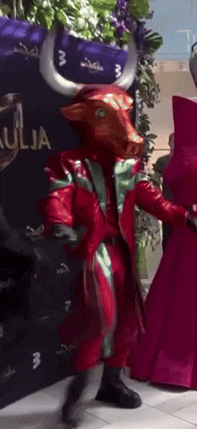 a person dressed in a bull costume is dancing