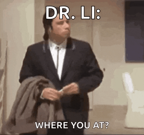 a man in a suit is standing in a room with a jacket on his shoulder and asking where he is .