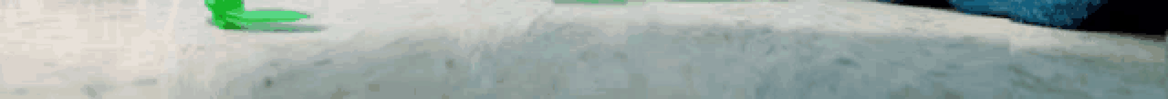 a blurry picture of a person walking down a sidewalk .