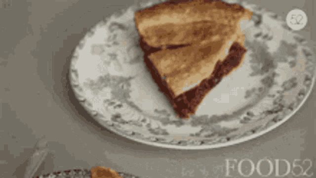 a slice of pie is on a plate with the word food on it