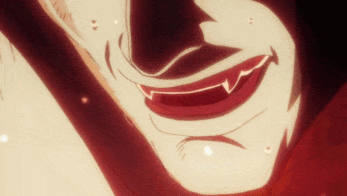 a close up of a vampire 's mouth with sharp teeth