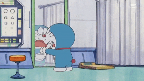 a cartoon character named doraemon is standing in front of a mirror