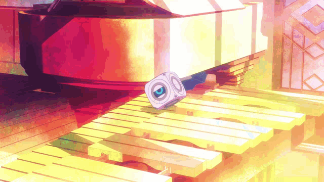 a cd player is sitting on a wooden table in front of a grand piano