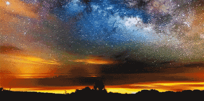 a sunset with a galaxy in the sky