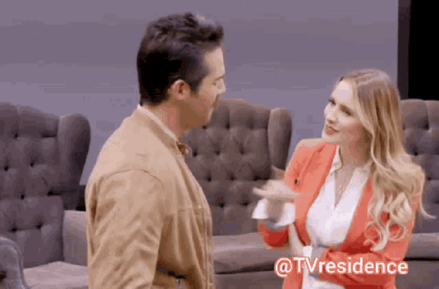 a man and a woman are standing next to each other with a caption that says tvresidence