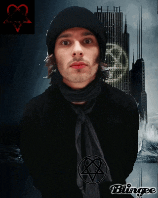 a man wearing a black hat and scarf has a pentacle on his neck