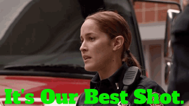 a female firefighter stands in front of a red vehicle with the words it 's our best shot