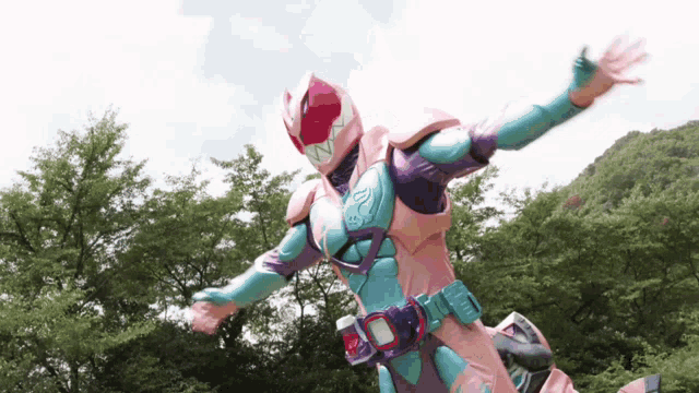 a person in a purple and pink superhero costume is flying through the air