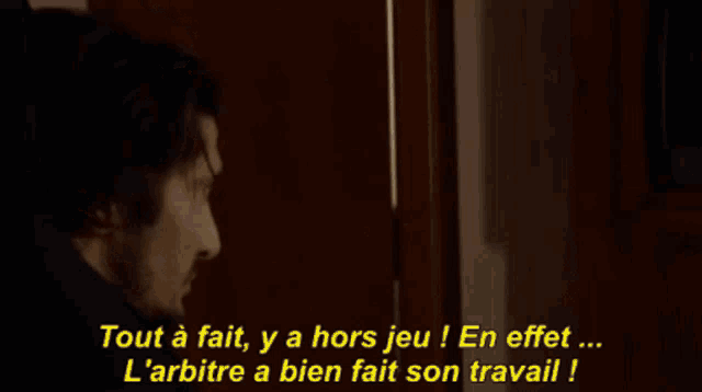 a man with a beard is yelling in french