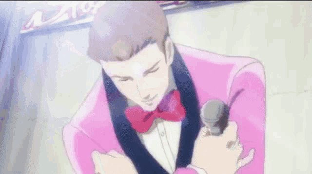 a man in a pink suit and bow tie is holding a sword in his hand .