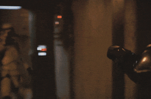 a storm trooper is holding a flamethrower in his hand