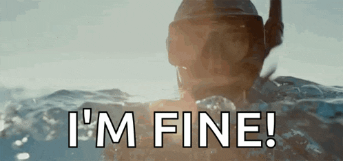 a man is swimming in the ocean and saying i 'm fine