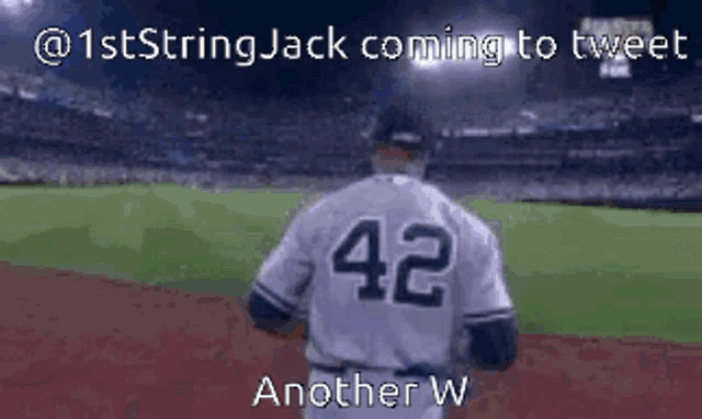 a baseball player with the number 42 on his jersey stands on the field