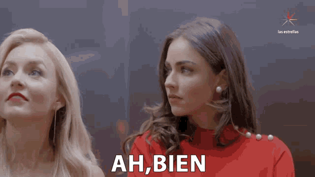 two women are standing next to each other and one of them says " ah bien "