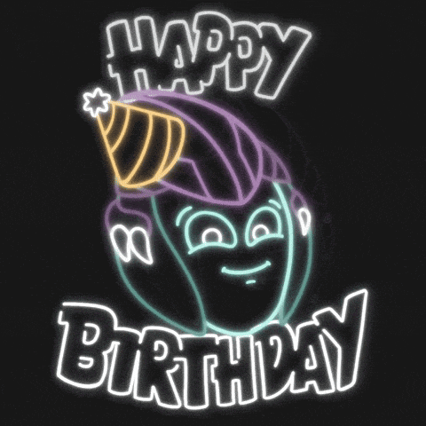 a neon sign that says happy birthday with a cartoon face