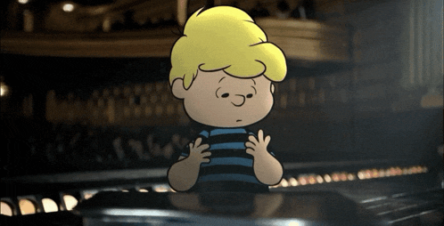a cartoon boy is sitting at a piano with his hands on the keyboard